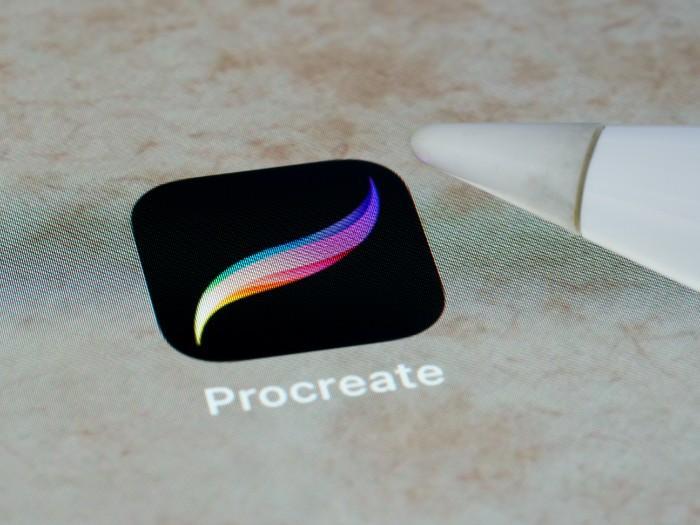 Close-up of the Procreate app and the tip of an Apple Pencil