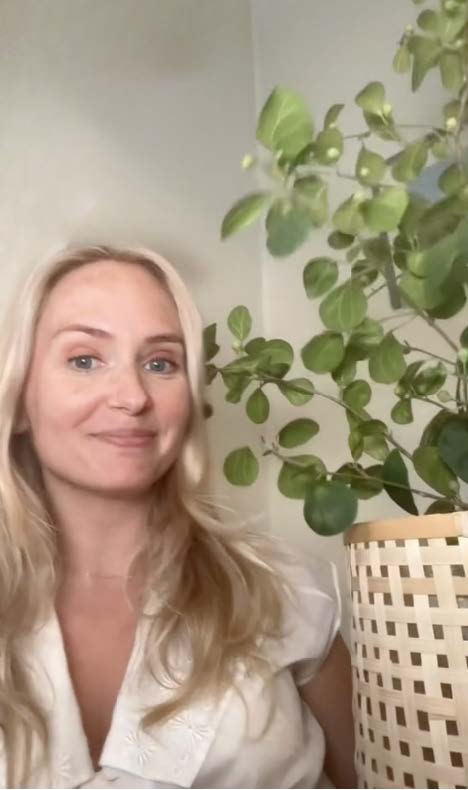 Maria-Katarina Johannesson and a green plant, white top